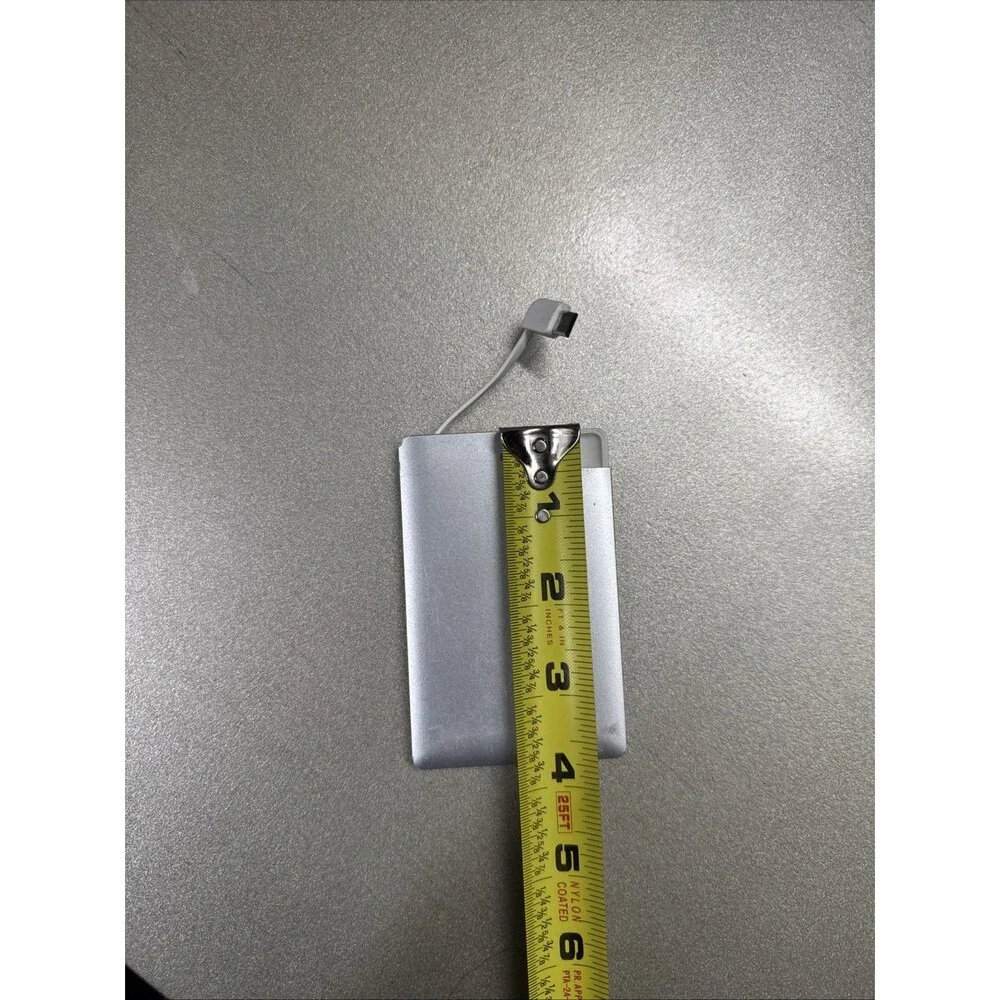 Ultra Slim portable charger silver with looks like Micro-USB cord see photos